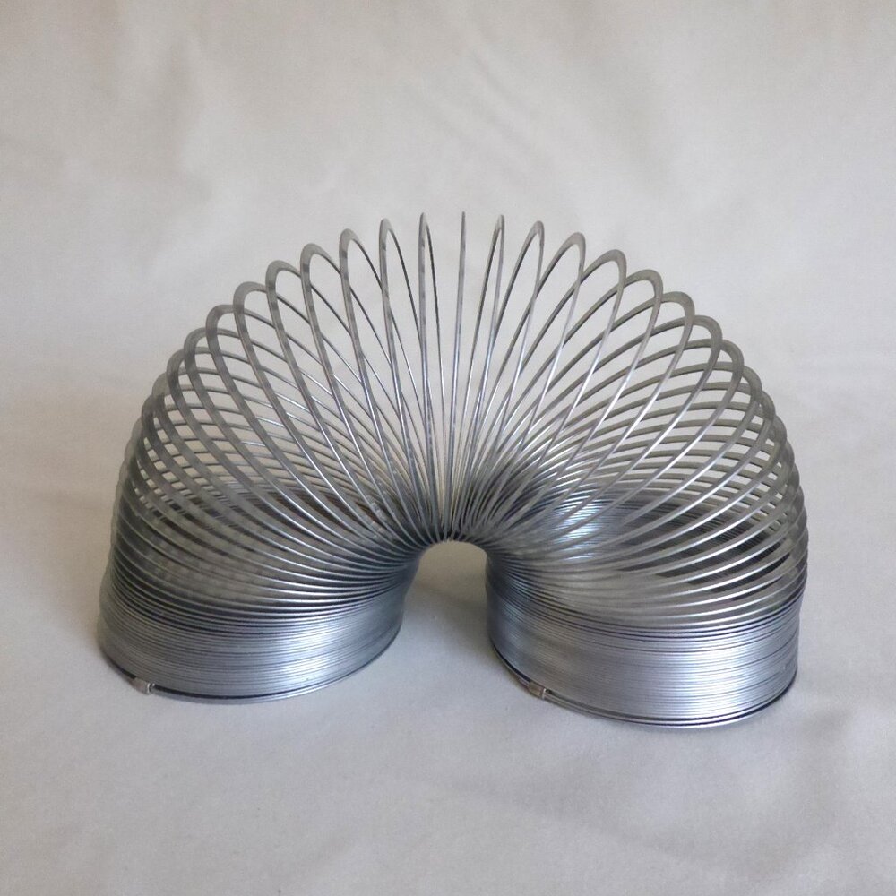 VINTAGE THE ORIGINAL SLINKY METAL WALKING SPRING TOY EXCELLENT CONDITION